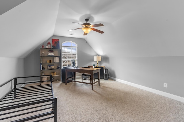 office area with carpet, a ceiling fan, baseboards, lofted ceiling, and visible vents