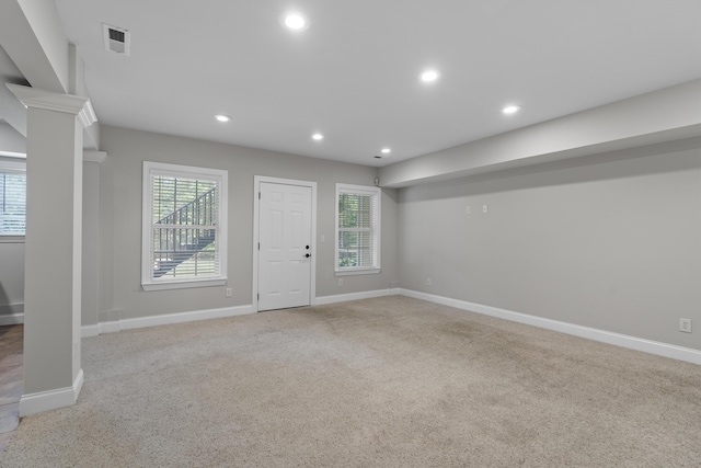 foyer with a wealth of natural light, carpet, recessed lighting, and visible vents