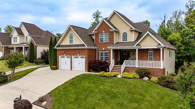 craftsman-style home featuring a shingled roof, a front lawn, brick siding, a porch, and concrete driveway