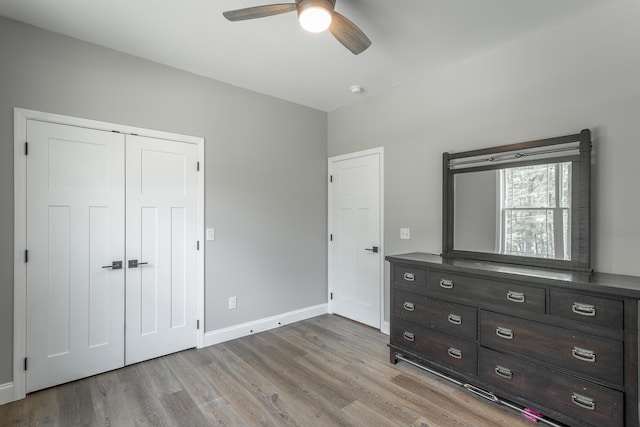 485 Woodland Dr, Jasper, TN 37347 - unfurnished bedroom with a closet, baseboards, and light wood-style floors