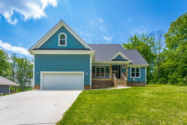 485 Woodland Dr, Jasper, TN 37347 - craftsman inspired home with a garage, a porch, driveway, and a front yard
