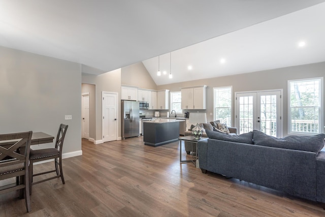 485 Woodland Dr, Jasper, TN 37347 - living room featuring baseboards, french doors, dark wood-style floors, and high vaulted ceiling