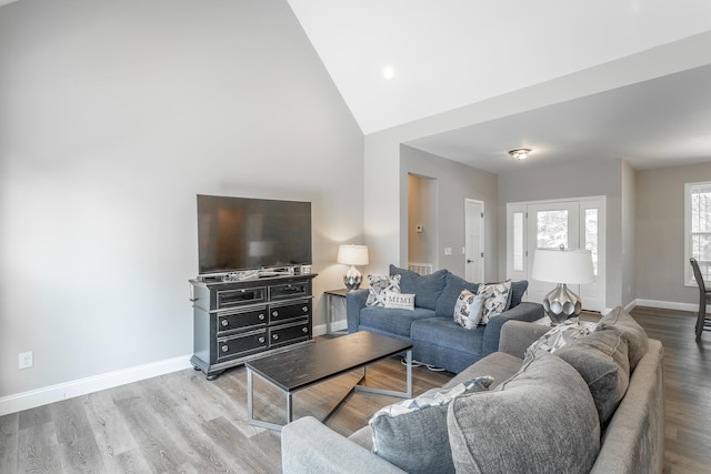 485 Woodland Dr, Jasper, TN 37347 - living room featuring baseboards, wood finished floors, and high vaulted ceiling
