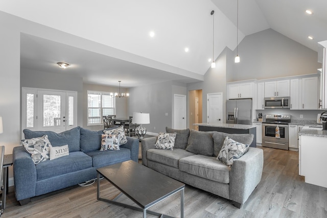 485 Woodland Dr, Jasper, TN 37347 - living room featuring an inviting chandelier, recessed lighting, wood finished floors, and high vaulted ceiling