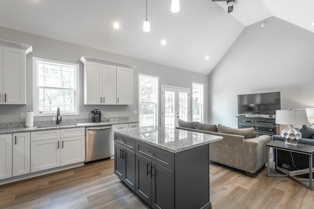 485 Woodland Dr, Jasper, TN 37347 - kitchen with white cabinetry, open floor plan, a sink, and dishwasher