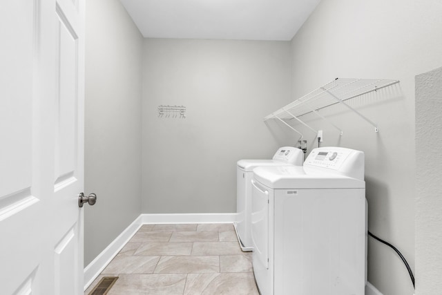 2211 Kirby Ave, Chattanooga, TN 37404 - laundry area featuring independent washer and dryer and baseboards