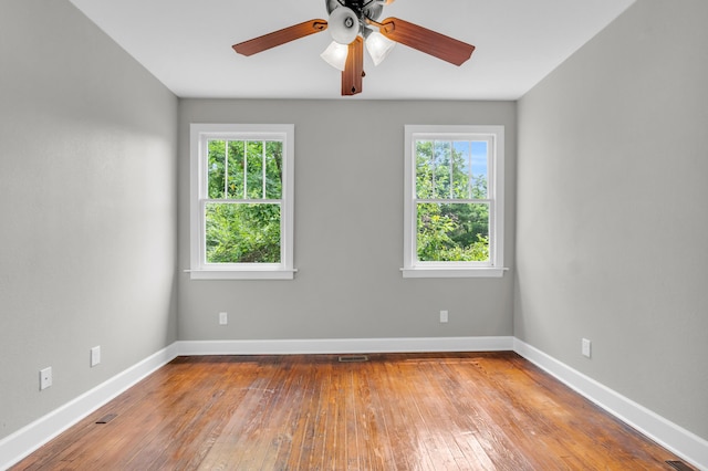 2211 Kirby Ave, Chattanooga, TN 37404 - unfurnished room with healthy amount of natural light, hardwood / wood-style flooring, and a ceiling fan