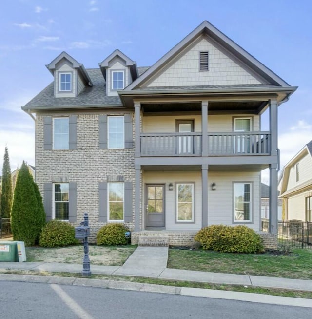 8520 Winter Refuge Way, Ooltewah, TN 37363 - view of front of home featuring fence, a balcony, and brick siding