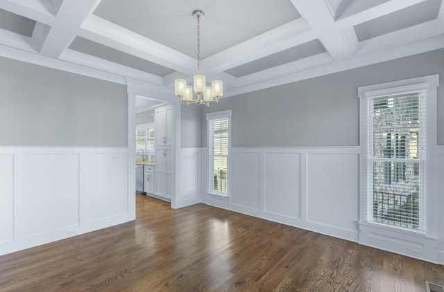 8520 Winter Refuge Way, Ooltewah, TN 37363 - unfurnished dining area featuring beam ceiling, a notable chandelier, coffered ceiling, and a decorative wall