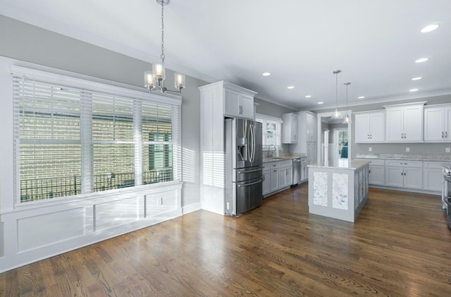 8520 Winter Refuge Way, Ooltewah, TN 37363 - kitchen with appliances with stainless steel finishes, an inviting chandelier, white cabinets, and a sink