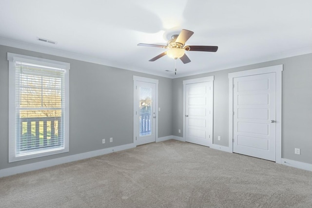8520 Winter Refuge Way, Ooltewah, TN 37363 - unfurnished bedroom with light colored carpet, visible vents, ceiling fan, baseboards, and ornamental molding