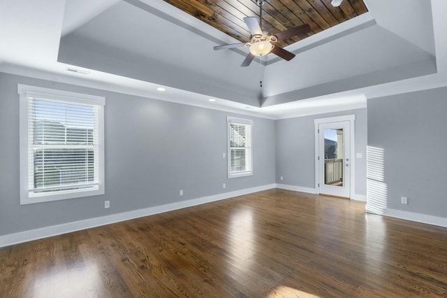 8520 Winter Refuge Way, Ooltewah, TN 37363 - unfurnished room featuring dark wood-style flooring, ceiling fan, a tray ceiling, and baseboards