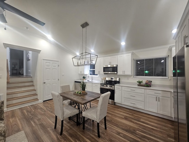 1680 Rolling Brook Dr NE, Cleveland, TN 37323 - dining room featuring dark wood-type flooring, ornamental molding, lofted ceiling, stairs, and recessed lighting