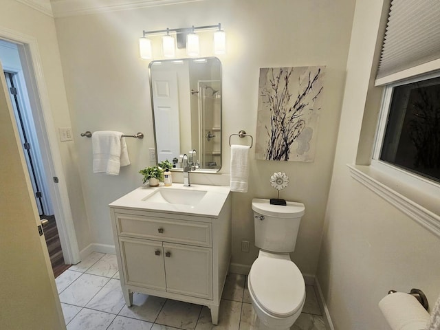 1680 Rolling Brook Dr NE, Cleveland, TN 37323 - bathroom featuring vanity, toilet, marble look tiles, baseboards, and ornamental molding