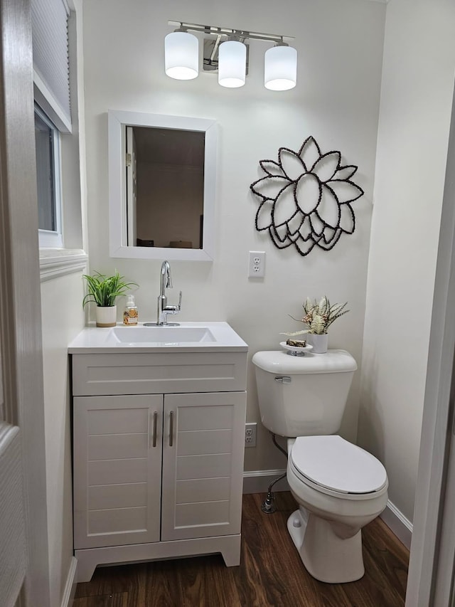 1680 Rolling Brook Dr NE, Cleveland, TN 37323 - half bathroom featuring wood finished floors, toilet, vanity, and baseboards