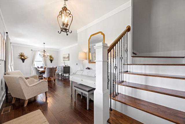 13111 Jones Gap Rd, Soddy Daisy, TN 37379 - staircase featuring a chandelier, hardwood / wood-style floors, and crown molding