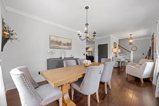 13111 Jones Gap Rd, Soddy Daisy, TN 37379 - dining space featuring a chandelier, stairway, dark wood-style flooring, and crown molding