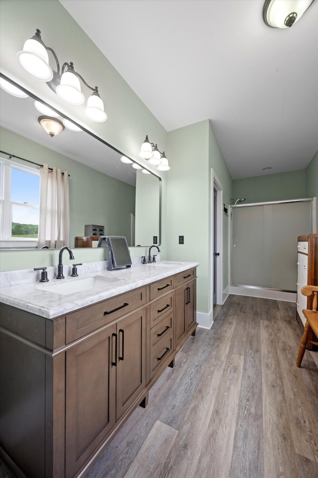 13111 Jones Gap Rd, Soddy Daisy, TN 37379 - full bathroom with an enclosed shower, double vanity, and wood finished floors