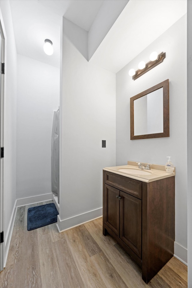 13111 Jones Gap Rd, Soddy Daisy, TN 37379 - full bath with vanity, wood finished floors, and a stall shower