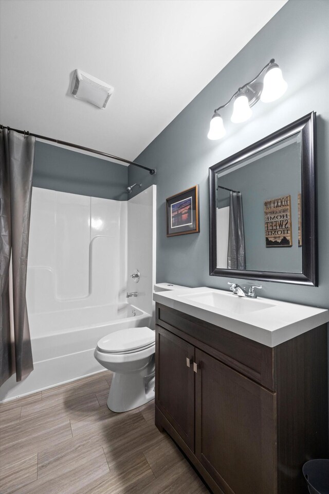 13111 Jones Gap Rd, Soddy Daisy, TN 37379 - full bathroom with shower / tub combo, vanity, and wood finished floors
