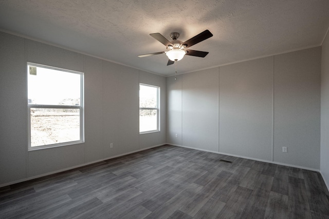 unfurnished room featuring ornamental molding, dark wood-style floors, a textured ceiling, and ceiling fan