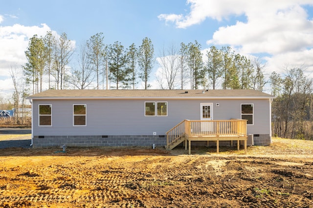 rear view of house with a wooden deck, crawl space, central AC unit, and roof with shingles