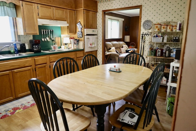 3421 Franklin Dr, Chattanooga, TN 37419 - dining room featuring wallpapered walls and light wood-style floors
