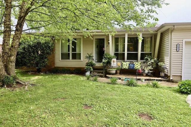 3421 Franklin Dr, Chattanooga, TN 37419 - view of front of home with a porch, an attached garage, and a front yard