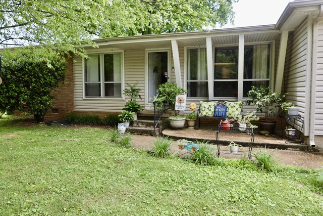 3421 Franklin Dr, Chattanooga, TN 37419 - entrance to property with a lawn, a porch, and crawl space