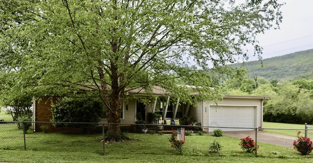 3421 Franklin Dr, Chattanooga, TN 37419 - view of front of home featuring a garage, driveway, and covered porch