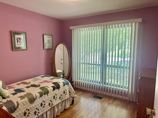 3421 Franklin Dr, Chattanooga, TN 37419 - bedroom with multiple windows and wood finished floors