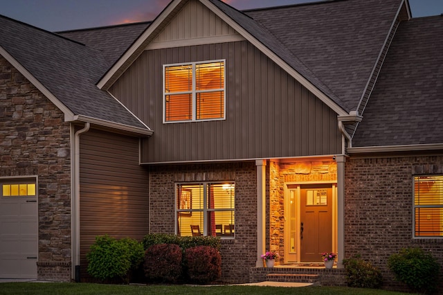 745 Soaring Eagle Cir, Hixson, TN 37343 - view of front facade featuring brick siding, stone siding, roof with shingles, and a garage