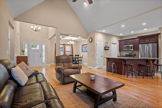 745 Soaring Eagle Cir, Hixson, TN 37343 - living room with light wood-style floors, recessed lighting, ceiling fan with notable chandelier, and high vaulted ceiling