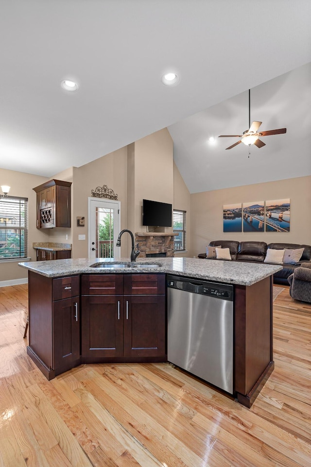 745 Soaring Eagle Cir, Hixson, TN 37343 - kitchen with open floor plan, light wood-type flooring, a sink, dishwasher, and vaulted ceiling