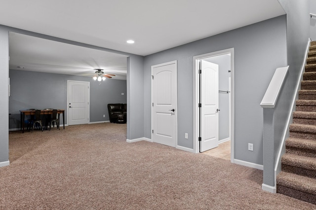 745 Soaring Eagle Cir, Hixson, TN 37343 - unfurnished living room featuring stairway, baseboards, ceiling fan, and light carpet