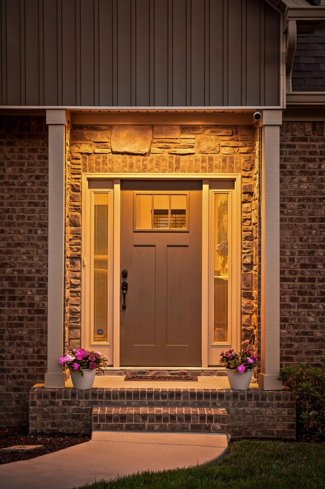 745 Soaring Eagle Cir, Hixson, TN 37343 - doorway to property with board and batten siding and brick siding