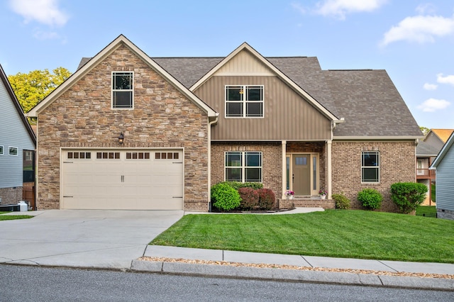 745 Soaring Eagle Cir, Hixson, TN 37343 - craftsman house with a front lawn, stone siding, a shingled roof, board and batten siding, and concrete driveway