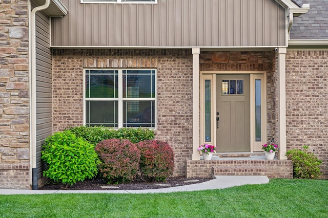 745 Soaring Eagle Cir, Hixson, TN 37343 - property entrance featuring board and batten siding, brick siding, and a shingled roof