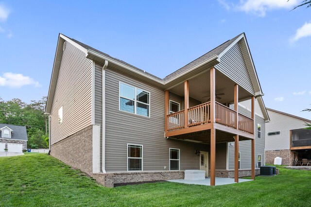 745 Soaring Eagle Cir, Hixson, TN 37343 - rear view of house with central air condition unit, a patio, a yard, and a balcony