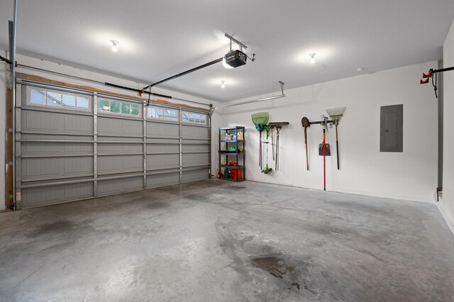745 Soaring Eagle Cir, Hixson, TN 37343 - garage featuring a garage door opener and electric panel