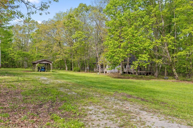 6475 Polly Ln, Signal Mountain, TN 37377 - view of grassy yard with a detached carport and a wooden deck