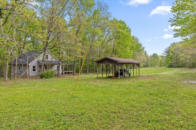 6475 Polly Ln, Signal Mountain, TN 37377 - view of green lawn with a carport and a forest view