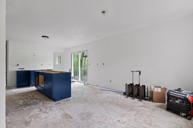 6475 Polly Ln, Signal Mountain, TN 37377 - kitchen with blue cabinets, wooden counters, and a peninsula
