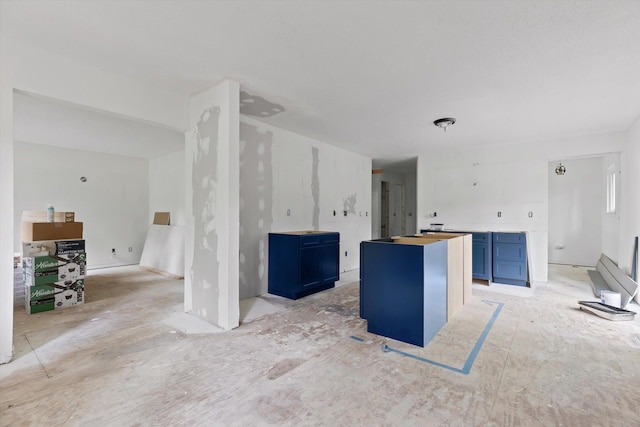 6475 Polly Ln, Signal Mountain, TN 37377 - kitchen with blue cabinetry and a kitchen island