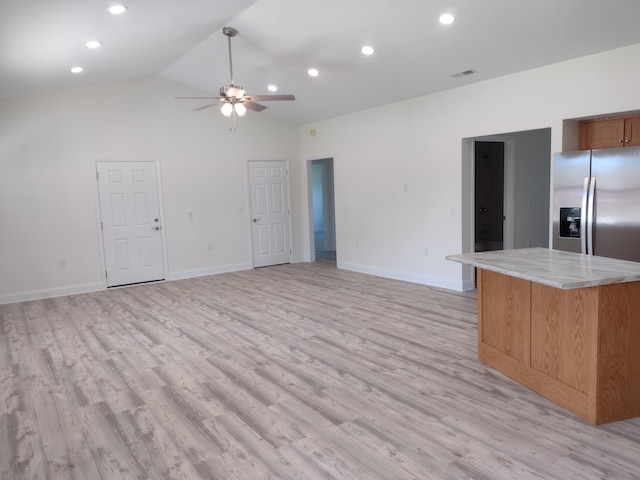 unfurnished living room featuring ceiling fan, visible vents, baseboards, and light wood finished floors