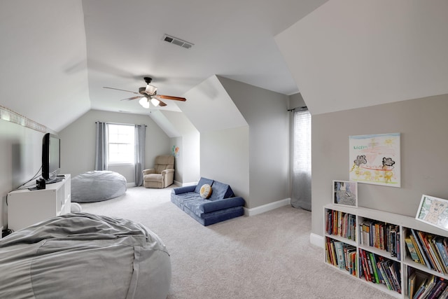 interior space featuring lofted ceiling, ceiling fan, baseboards, and visible vents
