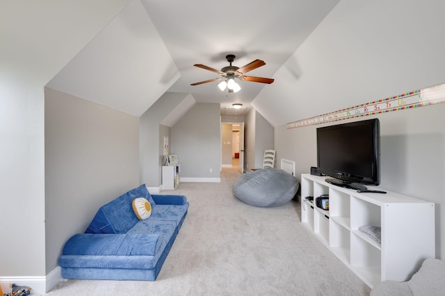 interior space featuring vaulted ceiling, baseboards, ceiling fan, and carpet floors