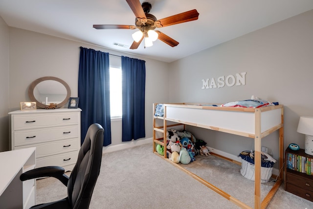 bedroom featuring baseboards, ceiling fan, visible vents, and light colored carpet