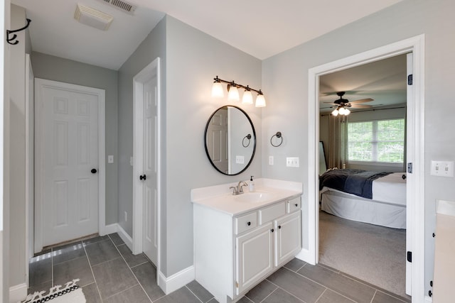 ensuite bathroom with a ceiling fan, tile patterned floors, ensuite bath, and vanity