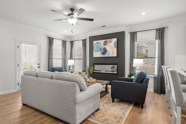 8418 Snowdrop Way, Ooltewah, TN 37363 - living room featuring visible vents, light wood-type flooring, recessed lighting, ornamental molding, and a ceiling fan
